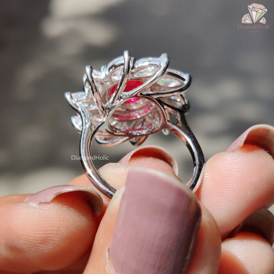 Discover our exquisite Round Cut Red Ruby Moissanite Halo Ring, featuring a sparkling design that combines the brilliance of moissanite with the allure of ruby. Perfect for a unique engagement!

